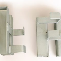 Scaffold toe board clamps, sometimes referred to as horseshoe clips, are used to secure toe boards to vertical standards of a scaffold structure.